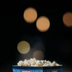 Popcorn in a cinema setting with blurred lights