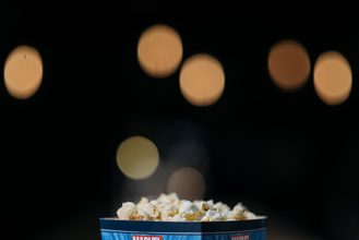 Popcorn in a cinema setting with blurred lights